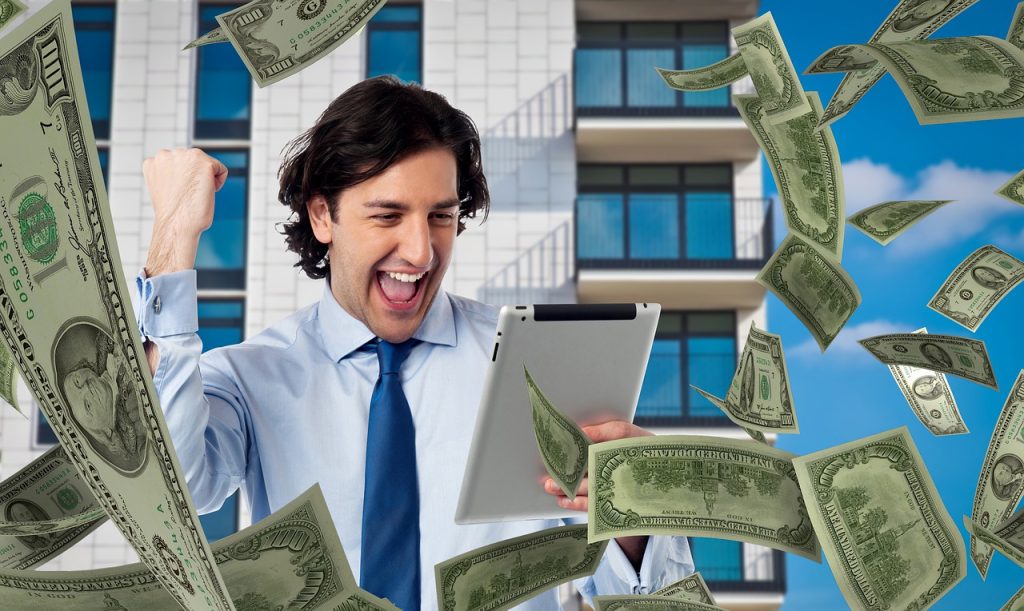 Man making money at his computer